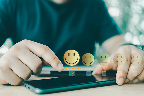 istock User touch on virtual check mark for choosing happy face with 5 star for giving best service by smart phone. 2244986077