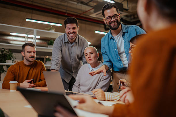 istock Diverse business team collaborating and smiling during office meeting 2244988546