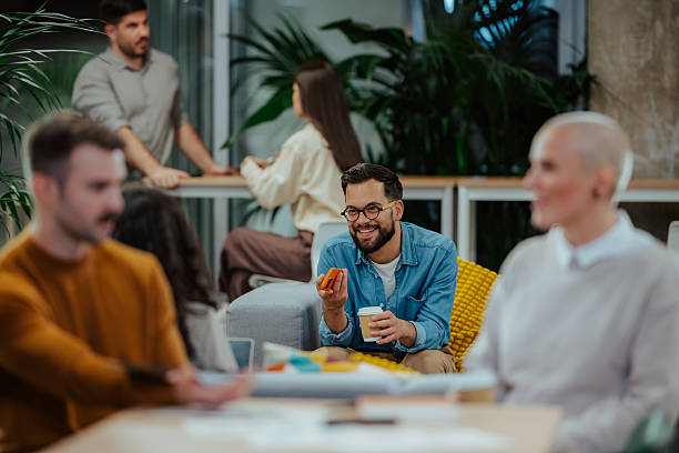 istock Diverse colleagues collaborating and relaxing in modern office during break 2244988948