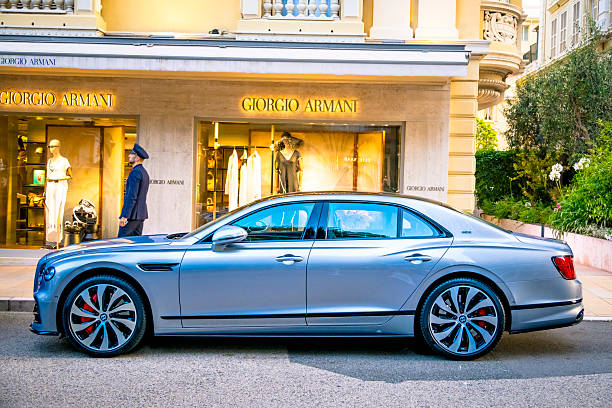 Bentley Flying Spur luxury performance sedan parked on the street in front of the Giorgio Armani store in Monte Carlo, Monaco along the Côte d'Azur.