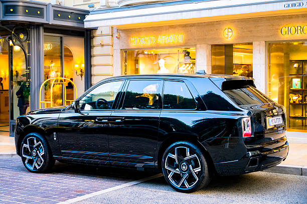Rolls Royce Cullinan luxury SUV parked on the street in front of the Giorgio Armani store in Monte Carlo, Monaco along the Côte d'Azur.