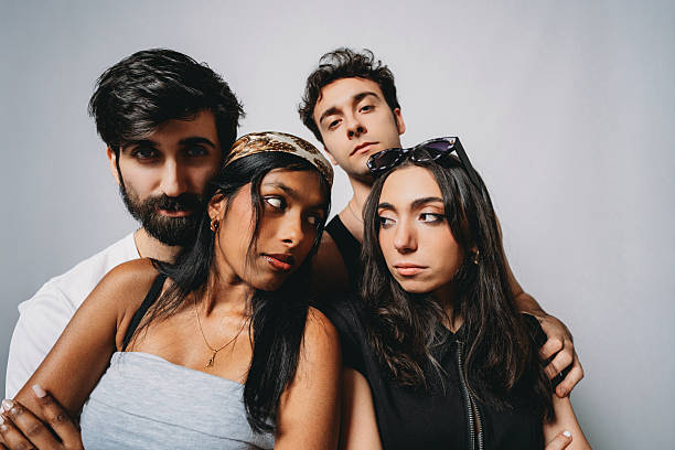 istock Diverse young adults posing together looking away 2244990665