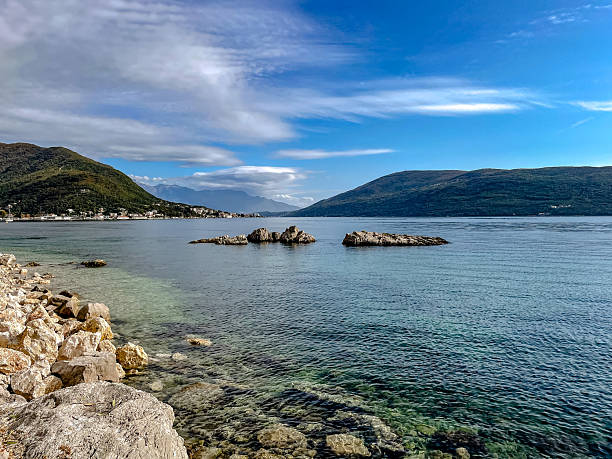 istock pristine rocky formations by peaceful waters, vivid coastal scene with striking rocks and calm waves 2244993859