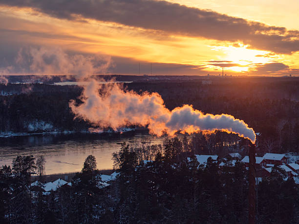 istock Smoke from a heating plant in winter at sunset 2244995852