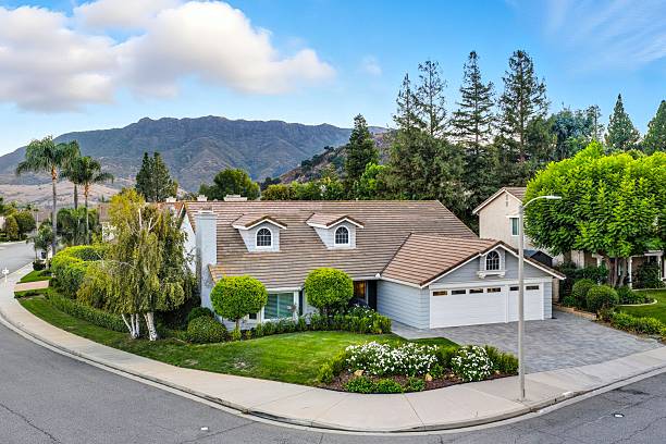 istock Suburban house with garden and mountain view. 2244997257