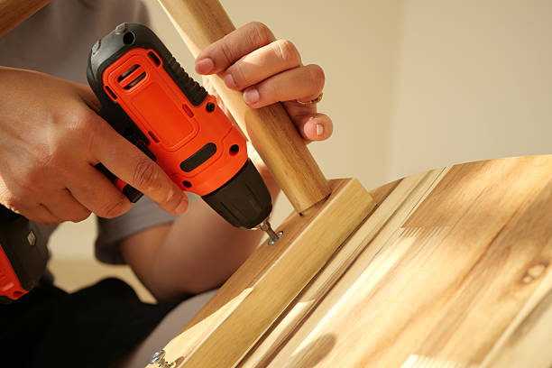 istock Building a wooden furniture piece using a drill tool 2245000138