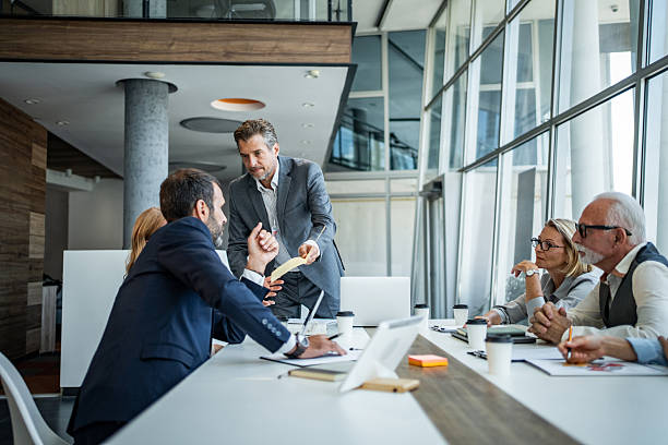 istock Business colleagues collaborating on project during office meeting 2245002355