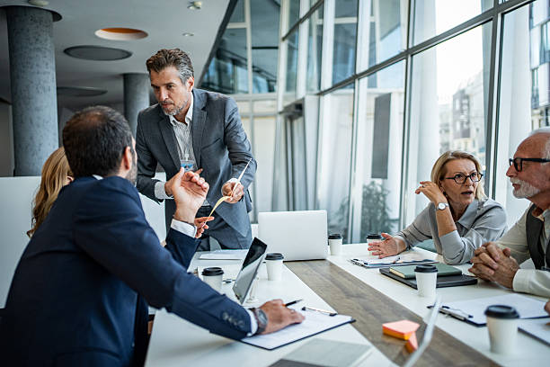 istock Diverse business people arguing during intense office meeting 2245002358