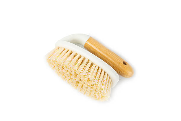 Bamboo cleaning brush isolated on white background. Eco-friendly cleaning products on white background. Cleaner concept. Cleaning supplies. Plastic-free items. Cleaning brush with wooden handle