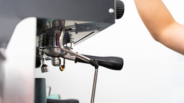 istock Person making coffee with an espresso machine in a cafe 2245003253