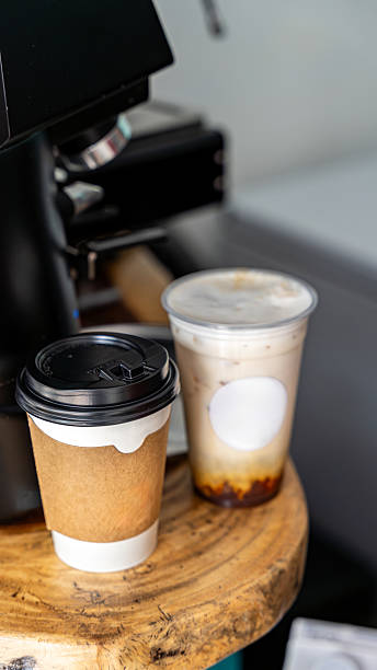 istock Takeaway coffee cups on a wooden table 2245003328
