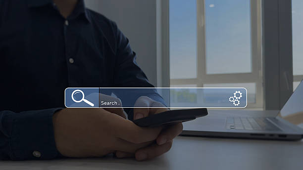 istock Businessman hands clicking internet search page on touch screen. Searching information on internet.Searching the internet helps find information, connect ideas and explore digital knowledge. 2245003536