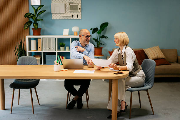 istock Business colleagues collaborating on documents during office meeting 2245004678