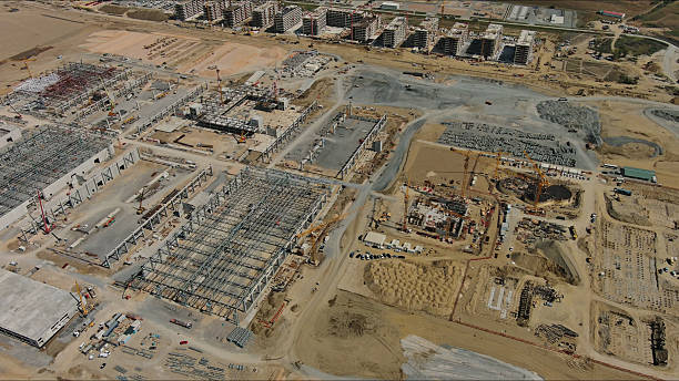istock Industrial construction site with construction equipment and materials 2245005401
