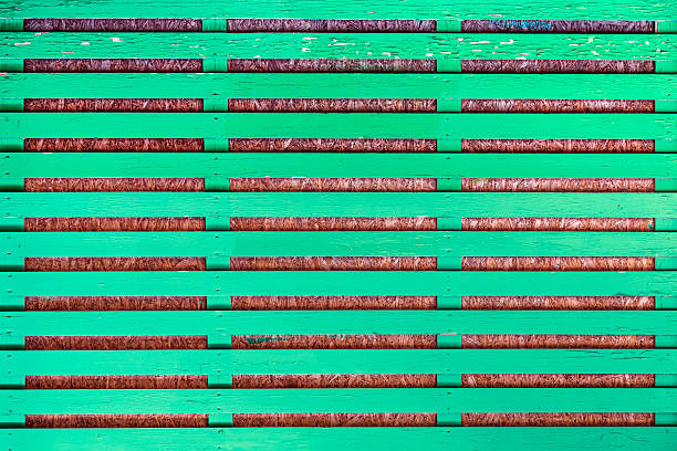 Part of a green fence made of wood