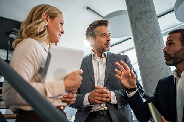 istock Business colleagues discussing ideas and strategy in modern office 2245007355