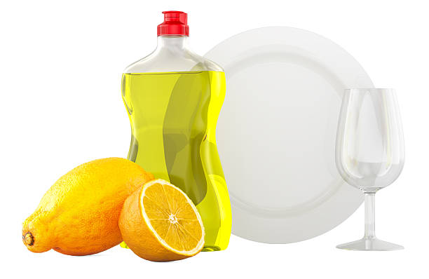 Liquid citric acid in a plastic bottle and pieces of fresh lemon. Closeup