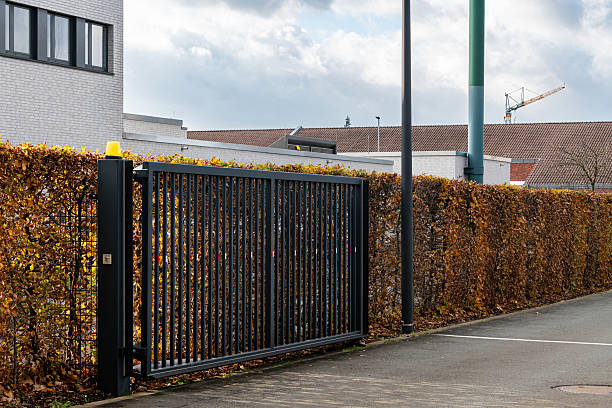 istock Modern gate opening in a landscaped area during daylight 2245009088