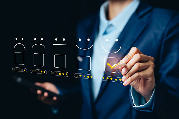 istock Customer satisfaction evaluation concept. Businessman selecting five-star rating with happy face icons on virtual feedback system showing excellent service experience 2245009999