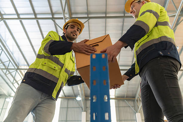 istock Warehouse worker working in warehouse storage. Foreman or worker work at factory site check up products in site. Inventory worker working in  factory Storehouse 2245012714