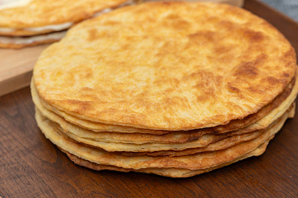 istock Woman Assembling Homemade Layered Puff Pastry Cake 2245015882