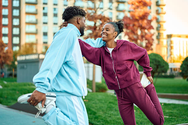 istock Happy couple stretching outdoors preparing for urban workout 2245019917