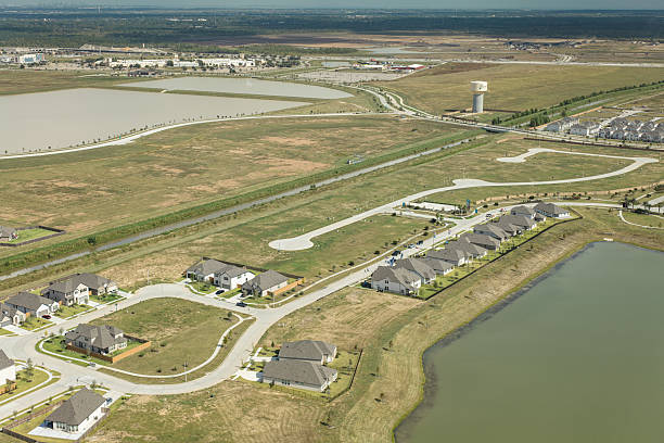 Aerial shot of single family homes under construction in a residential subdivision in Texas City, Texas on a Fall day.