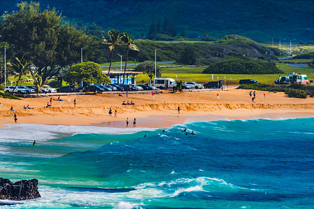 Colorful Body Surfers Shore Break Waves Sandy Beach Southeastern Oahu Hawaii. Famous Body Wave Board Surfing beach with Large Shore Break waves and barrels. Because of the shorebreak wave size, site of many neck injuries.