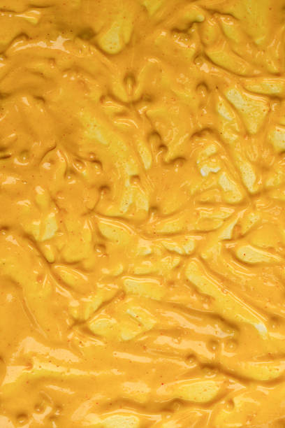 istock Yellow sauce splashes as a background. 2245026917