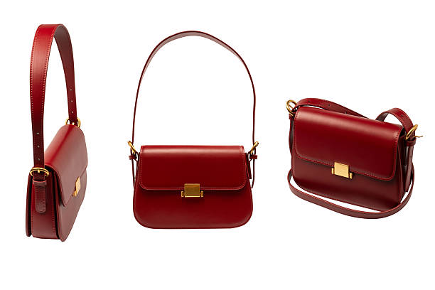 Burgundy shoulder leather bag isolated on a white background.