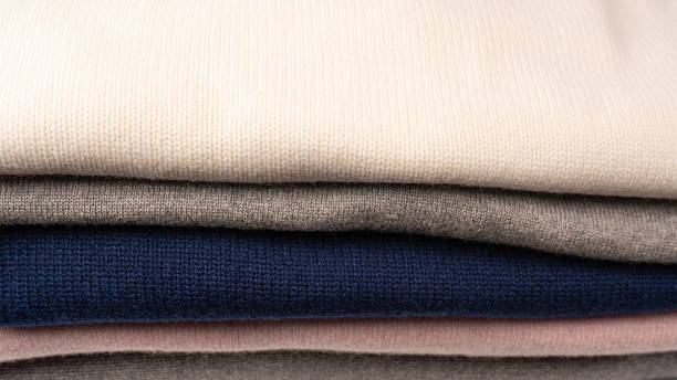 istock A group of warm sweaters isolated on a white background. 2245026943
