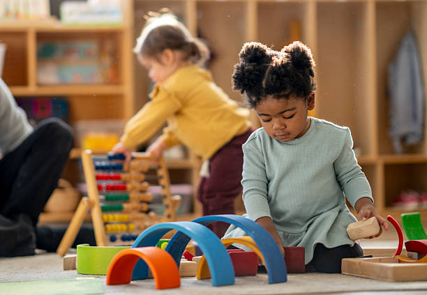 istock Daycare Scene With Children Playing Blocks And Learning At A Cozy Classroom 2245028354