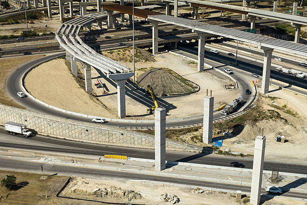 Aerial shot of a massive new cloverleaf interchange under construction in Live Oak, a suburb of San Antonio, on a sunny fall day. The project will expand Interstate 35 and connect it to Loop 1604.