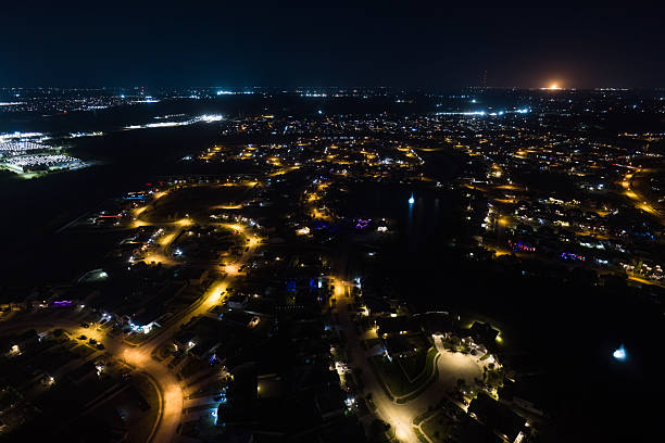 High angle area shot of a residential neighborhood in La Marque, a suburb of Houston, Texas, at night.