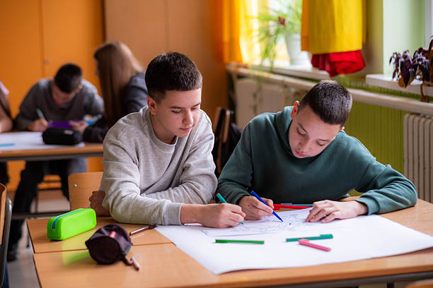 istock Students drawing together in a classroom during school lesson 2245031445