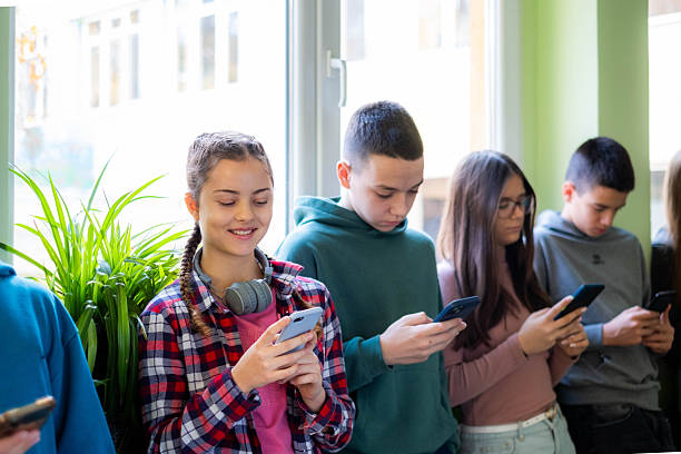 istock Teenagers checking smartphones, using social media, connecting online 2245032155