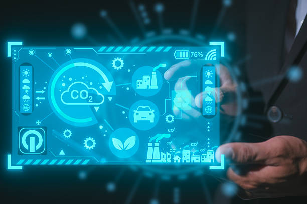 istock Reduce CO2 emissions and carbon footprint to limit global warming and climate change. Sustainable development and green businessman pointing at virtual diagram showing co2 emission icon 2245041627