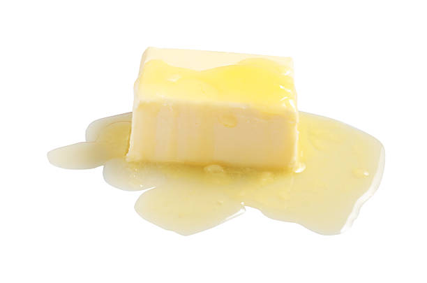 istock Piece of melting butter on white background 2245050313