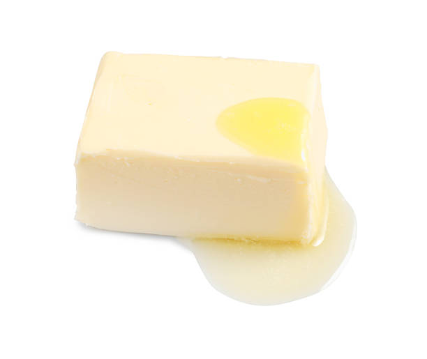 istock Piece of melting butter on white background 2245050403
