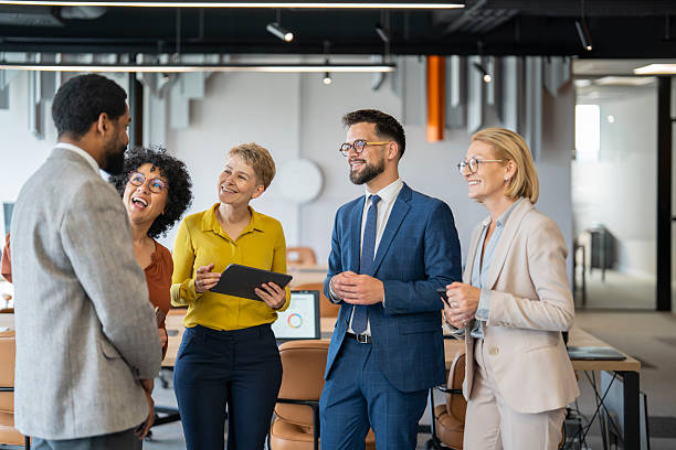 istock Diverse business team sharing a laugh during meeting in office 2245051395