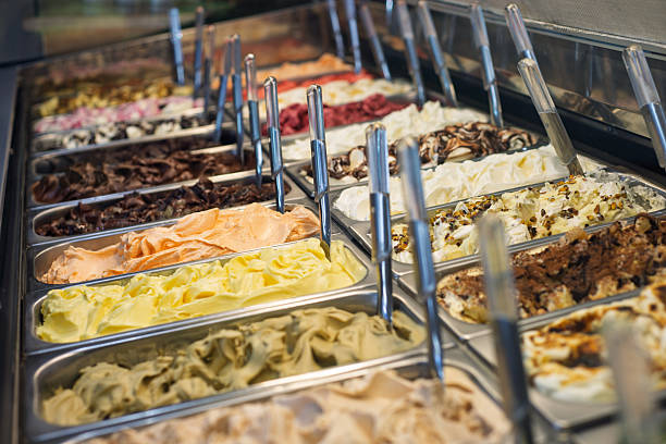 istock Italian gelato flavors in a display case with scoops 2245051422