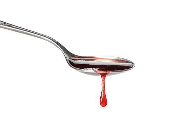 istock Spoon with tasty sweet jam isolated on white 2245053377