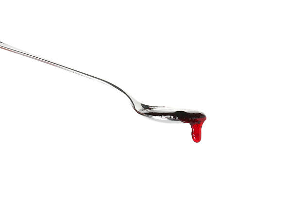 Spoon with tasty sweet jam isolated on white