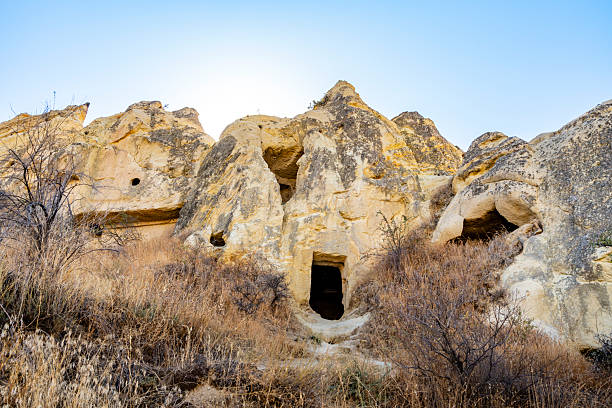 Cappadocia, Turkey, has a unique and striking landscape of soft volcanic rock formations called fairy chimneys that have been carved by erosion. This high-altitude, semi-arid region is marked by deep valleys, mountains, and plateaus, originally formed by ancient volcanic eruptions. The soft volcanic rock, or tuff, was also carved by early inhabitants to create elaborate underground cities, churches, and dwellings.