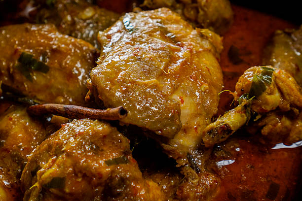 Chicken Rendang close up isolated on wooden background.