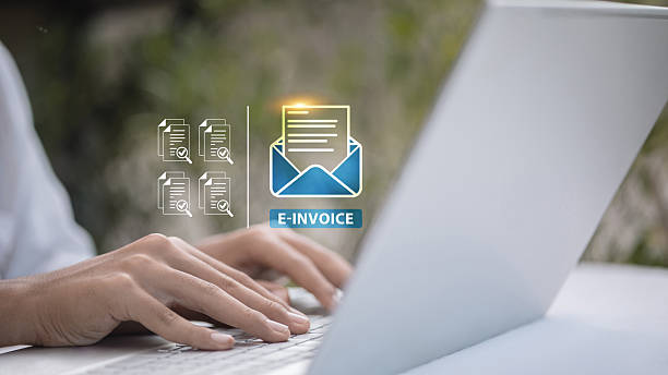istock Business person using laptop with e-invoice icon for digital billing, online payment, and financial document management 2245056178