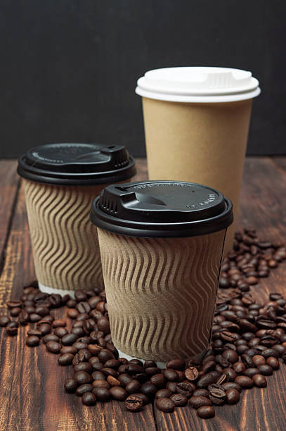 istock Three paper glasses with coffee and  Roasted coffee beans. copyspace. Coffee background. 2245059228