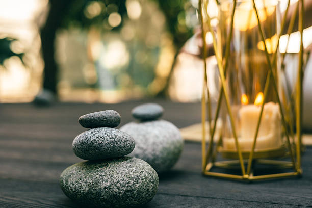 istock Balanced zen stones beside glowing candle creating a calm and peaceful atmosphere 2245061288