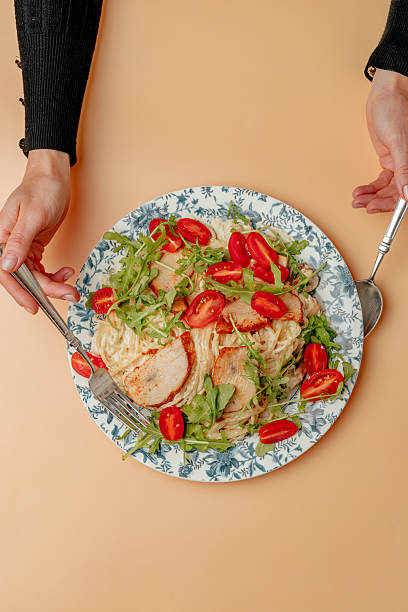 istock Pasta with shrimps, arugula and tomatoes isolated 2245062060