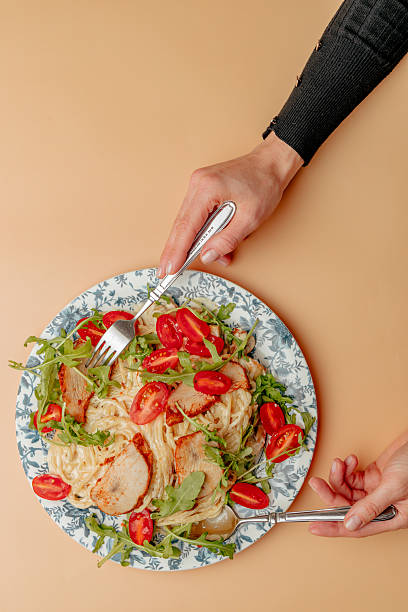 istock Pasta with shrimps, arugula and tomatoes isolated 2245062062